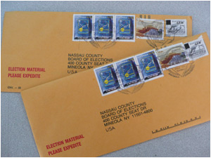 Absentee ballots, checked and ready to be mailed!