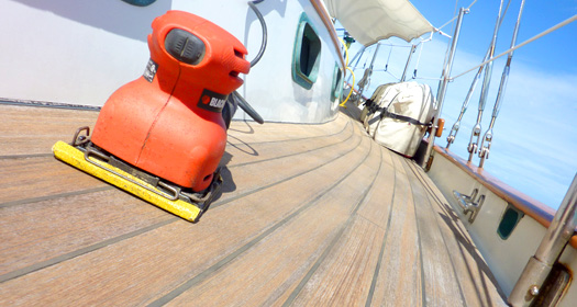 Sanding the decks to remove proud caulking